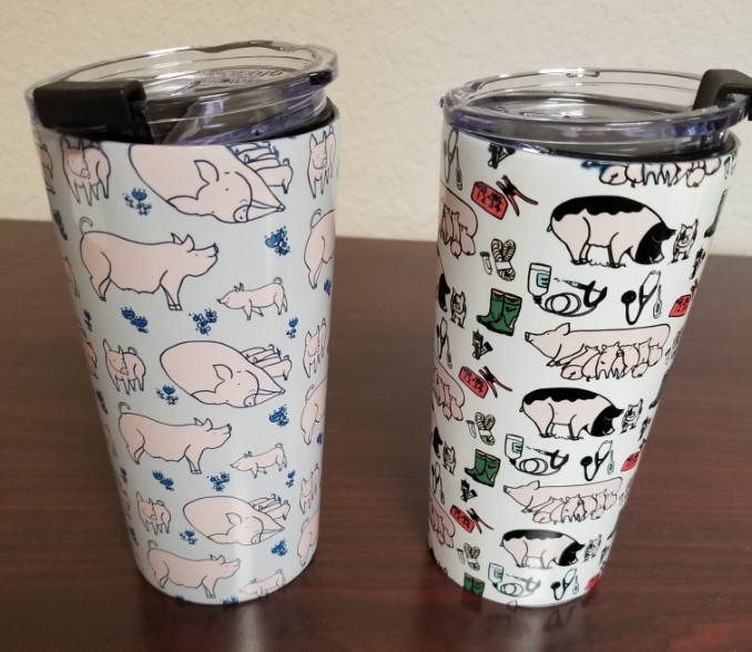 2 travel mugs with pig designs