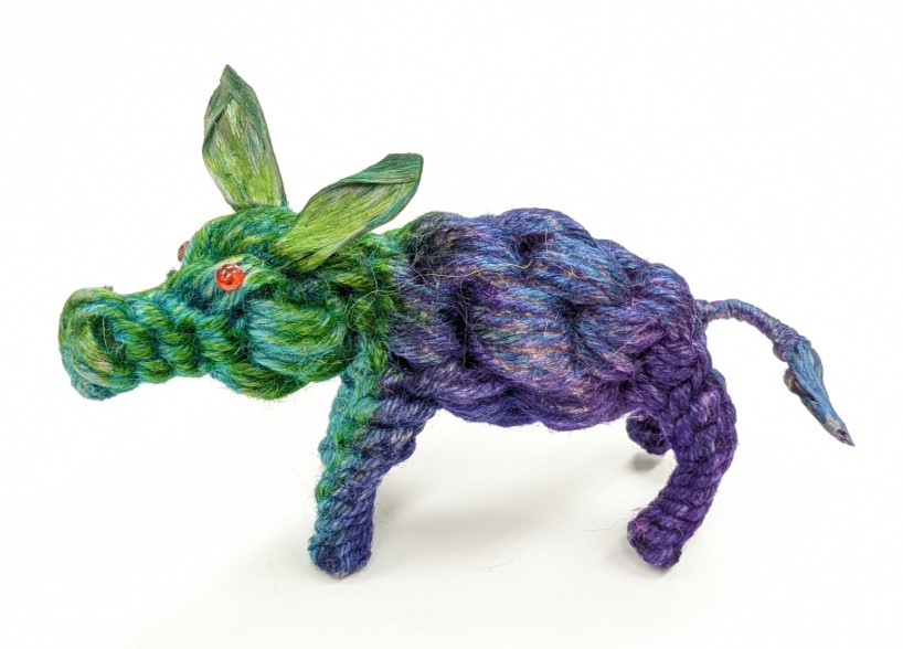 Artsy green and purple pig crafted from jute twine