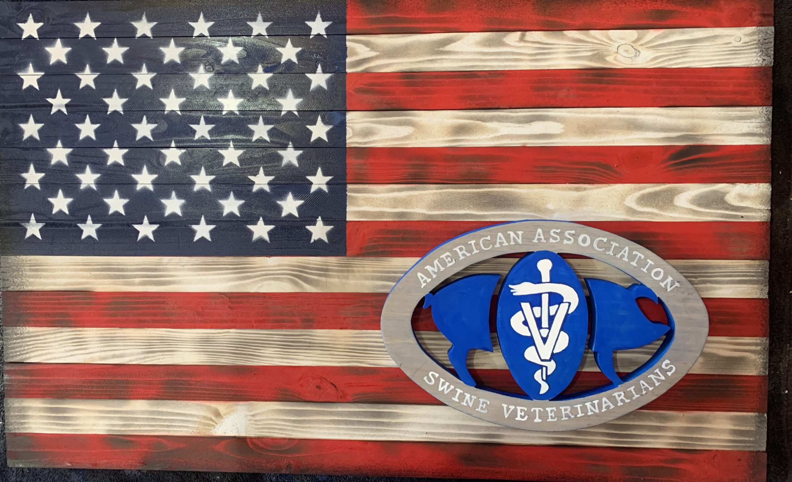 Wooden American flag with AASV logo